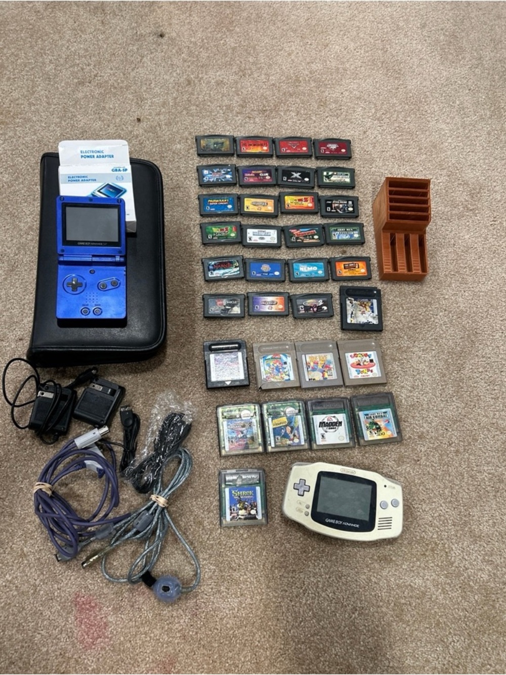 Nintendo Blue Game Boy Advance SP and White Game Boy Advance with Cartridges